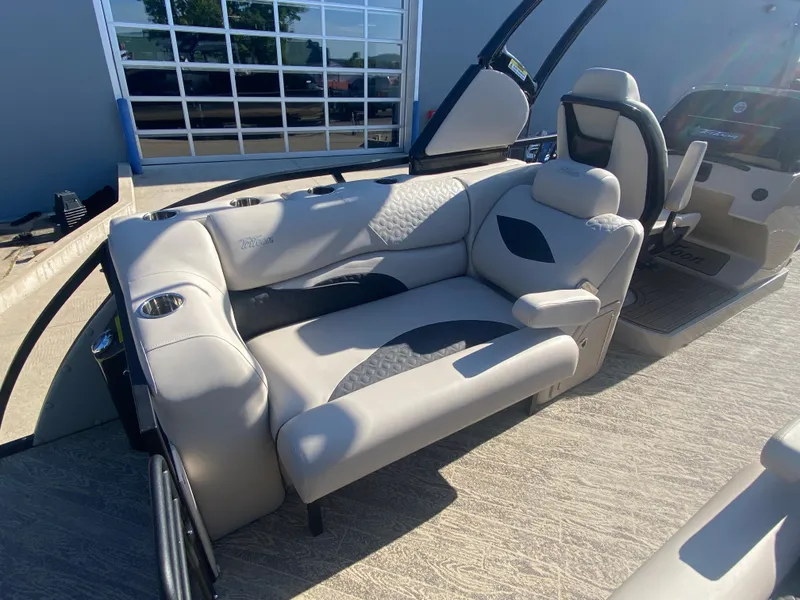 Slide: The Image of 2023 JC Sporttoon 26TT boat interior with plush seating and modern design. - 8