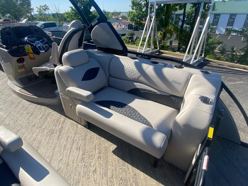 Slide: The Image of 2023 JC Sporttoon 26TT pontoon boat interior with plush seating and modern design. - 9