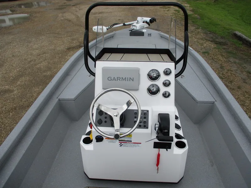 Slide: The Image of 2025 Vexus ACX2000 boat console with Garmin navigation system and steering wheel. - 13
