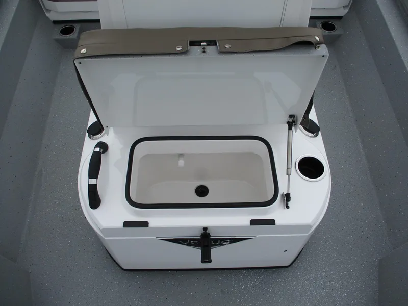 Slide: The Image of 2025 Vexus ACX2000 boat storage compartment with open lid and cup holders. - 14