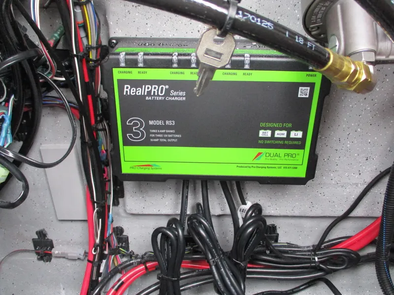 Slide: The Image of Battery charger in Vexus ACX2000, 2025 model, with RealPRO Series RS3, wiring visible. - 15