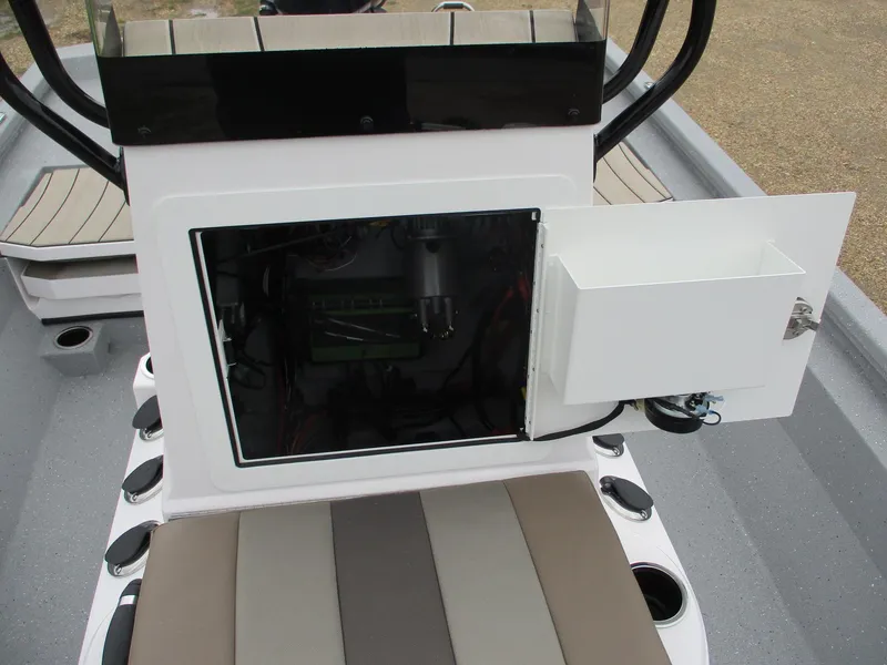 Slide: The Image of 2025 Vexus ACX2000 boat console with open storage compartment and seating. - 16