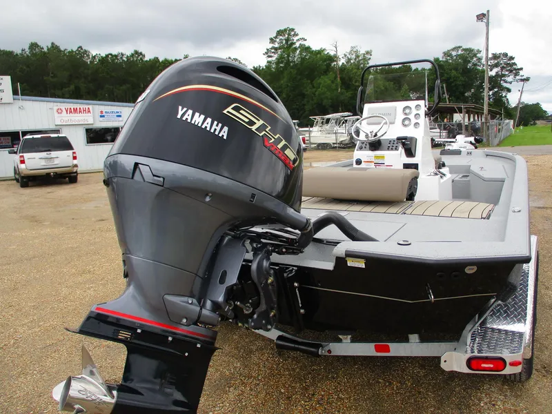 Slide: The Image of 2025 Vexus ACX2000 boat with Yamaha engine, parked outdoors near dealership. - 3