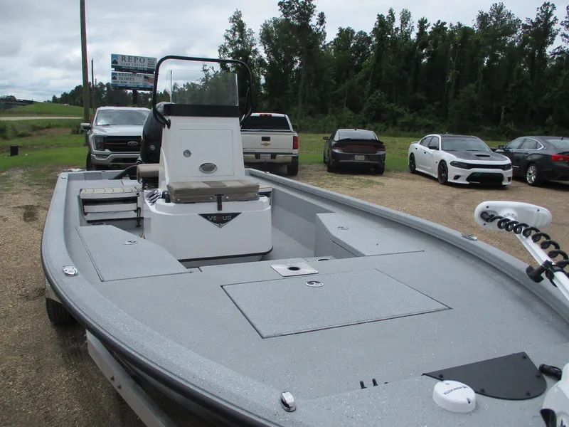 Slide: The Image of 2025 Vexus ACX2000 boat in parking lot, surrounded by cars and trees. - 5