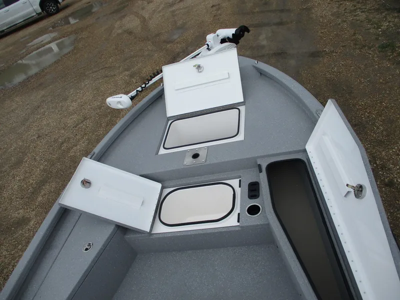 Slide: The Image of 2025 Vexus ACX2000 boat interior with open storage compartments and trolling motor. - 8