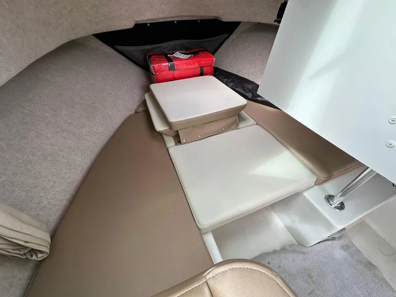 Slide: The Image of 2019 Parker 2120 Sport Cabin interior with seating and storage. - 6