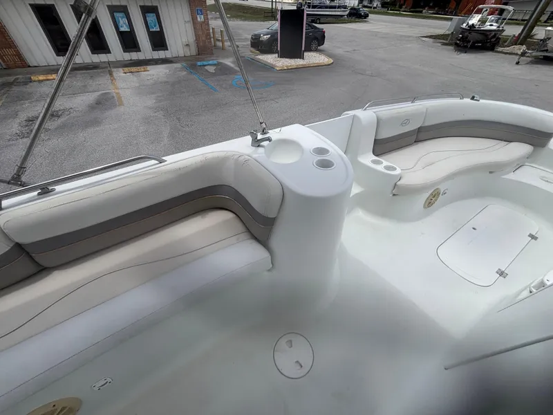 Slide: The Image of 2002 Monark Sunlounger 215 boat interior with cushioned seating and cup holders. - 20