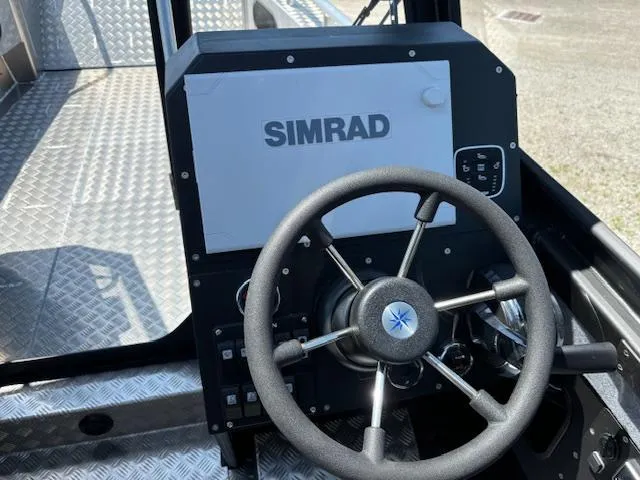 Slide: The Image of Steering wheel and Simrad display on 2024 Alukin CW750 boat. - 12