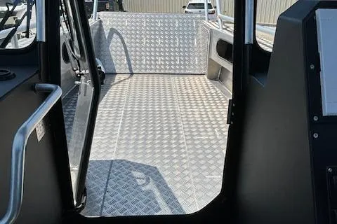 Slide: The Image of Interior view of 2024 Alukin CW750 boat with diamond-patterned flooring. - 16