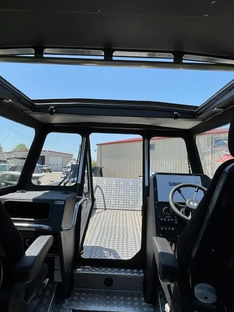 Slide: The Image of Interior view of 2024 Alukin CW750 boat, featuring modern cockpit and spacious cabin. - 5