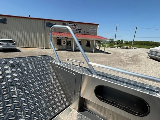 Slide: The Image of 2024 Alukin CW750 boat at dealership with metal flooring and railing. - 7