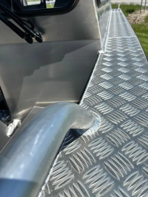 Slide: The Image of 2024 Alukin CW750 boat with diamond plate deck and railing detail. - 8