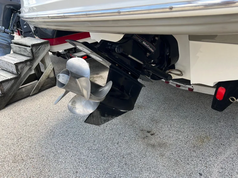 Slide: The Image of 2005 Sea Ray 220 Sundeck boat propeller and stern drive detail. - 25