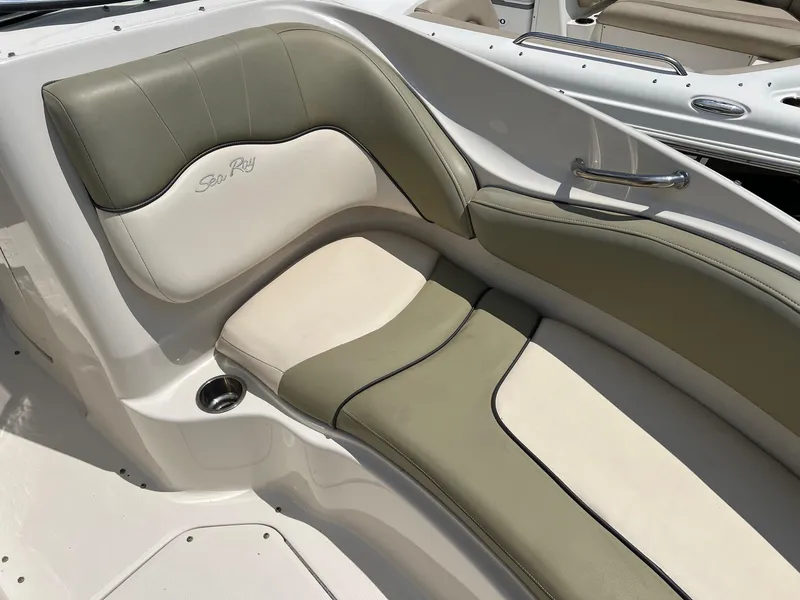 Slide: The Image of 2005 Sea Ray 220 Sundeck boat interior with green and cream seating. - 3