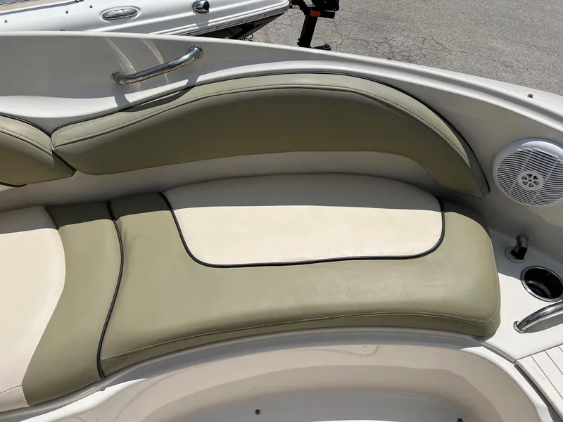 Slide: The Image of 2005 Sea Ray 220 Sundeck boat interior with beige and olive seating. - 5