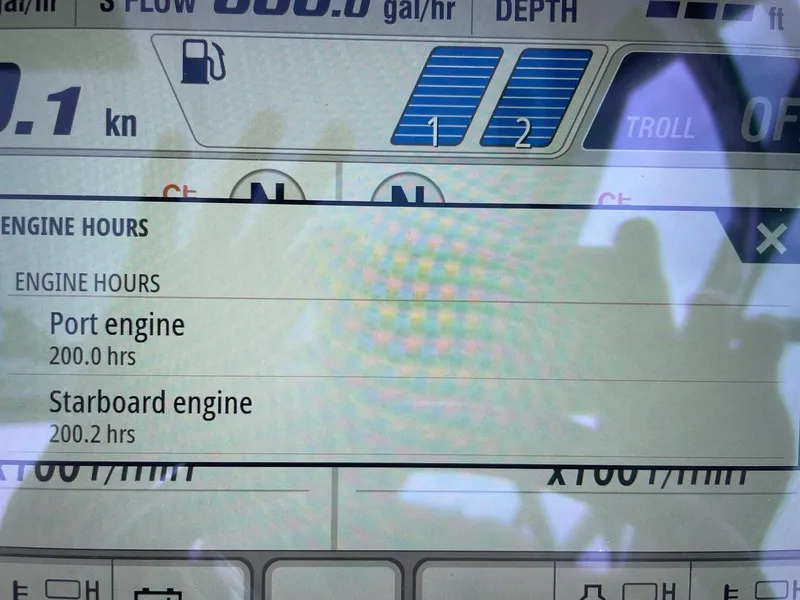 Slide: The Image of Display screen showing engine hours for Robalo R317 Dual Console, 2023 model. - 14