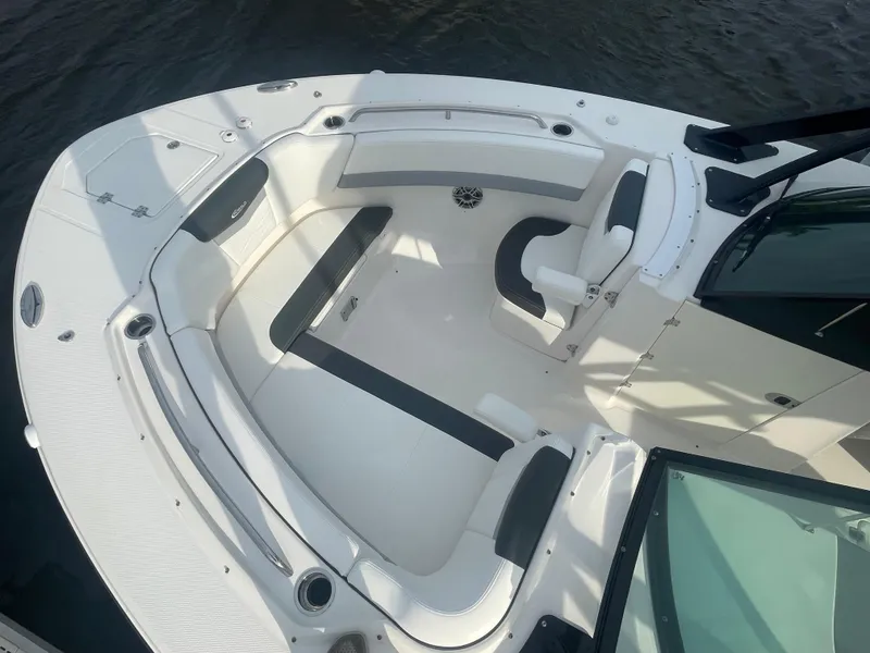 Slide: The Image of 2023 Robalo R317 Dual Console boat with spacious seating and sleek design. - 9