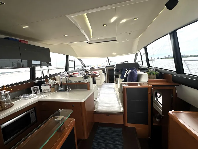 Slide: The Image of Luxurious interior of a 2013 Prestige 500 yacht with modern kitchen and seating area. - 16