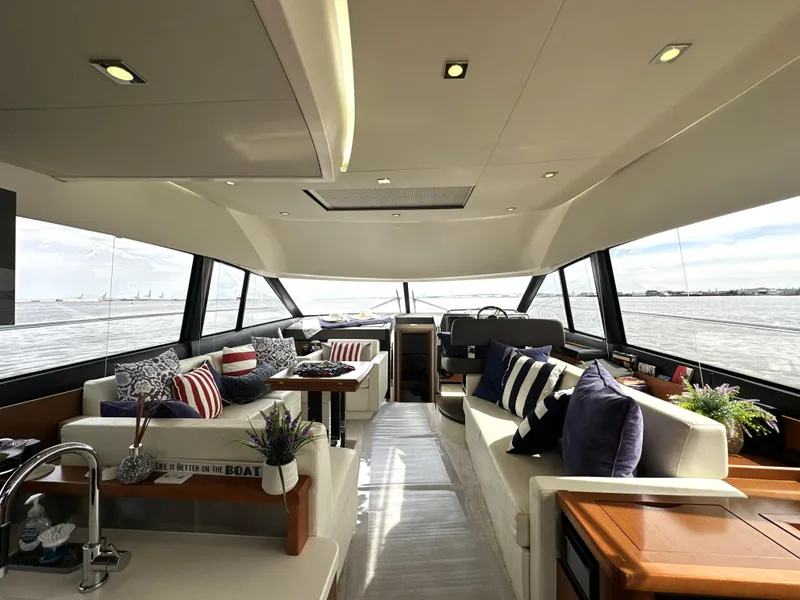 Slide: The Image of Luxurious interior of a 2013 Prestige 500 yacht with elegant seating and panoramic windows. - 17