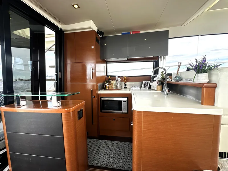 Slide: The Image of Luxurious kitchen interior of a 2013 Prestige 500 yacht with modern amenities. - 19