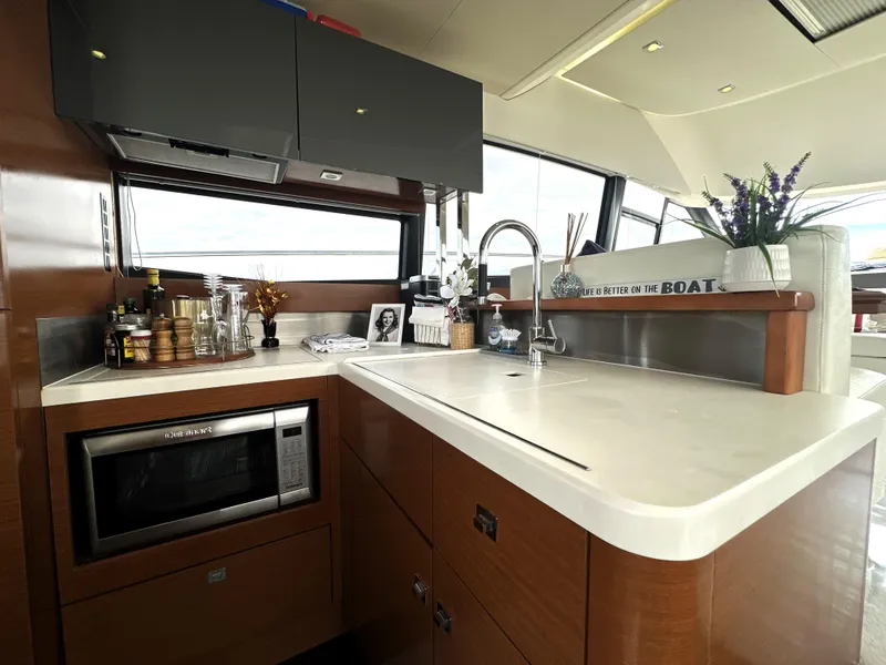 Slide: The Image of Luxurious kitchen interior on a 2013 Prestige 500 yacht, featuring modern appliances and sleek design. - 20