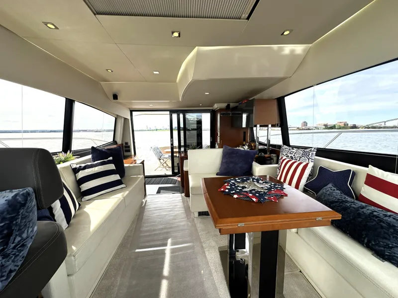Slide: The Image of Luxurious interior of a 2013 Prestige 500 yacht with elegant seating and nautical decor. - 21