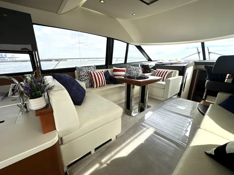 Slide: The Image of Luxurious interior of a 2013 Prestige 500 yacht with elegant seating and nautical decor. - 22