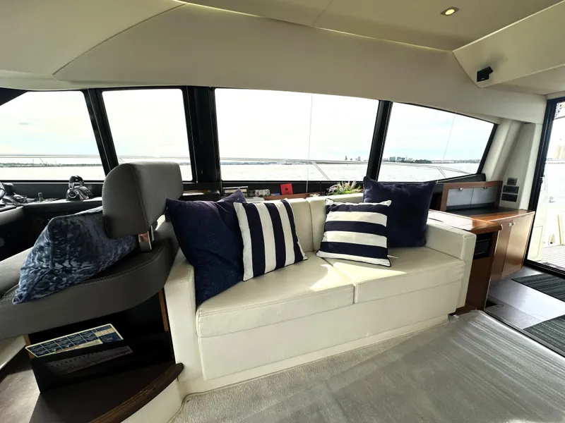 Slide: The Image of Luxurious interior of a 2013 Prestige 500 yacht with stylish seating and striped cushions. - 23