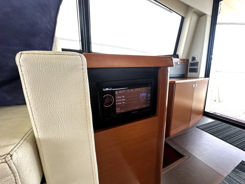 Slide: The Image of Interior of 2013 Prestige 500 yacht with modern control panel and wooden cabinetry. - 24