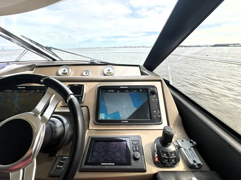 Slide: The Image of Cockpit view of 2013 Prestige 500 yacht with navigation controls and steering wheel. - 29