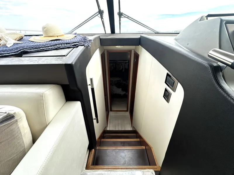 Slide: The Image of Interior view of a 2013 Prestige 500 yacht, featuring a staircase and modern design. - 32