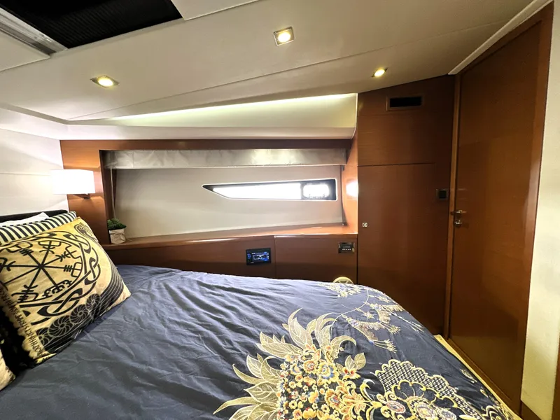 Slide: The Image of Luxurious cabin interior of 2013 Prestige 500 yacht with elegant bedding and modern lighting. - 35