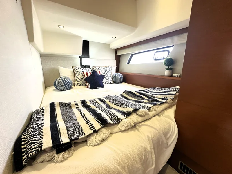 Slide: The Image of Luxurious bedroom interior of 2013 Prestige 500 yacht with stylish decor and cozy bedding. - 38