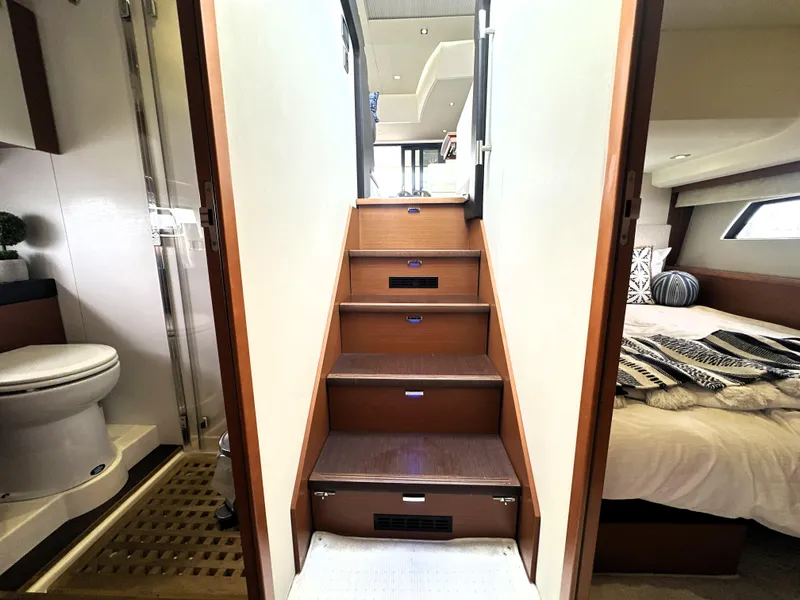 Slide: The Image of Interior of 2013 Prestige 500 yacht showing stairs, bathroom, and bedroom. - 39