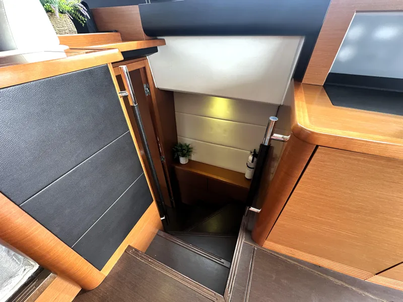 Slide: The Image of Interior stairs of a 2013 Prestige 500 yacht, featuring sleek wood finishes. - 41