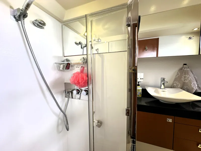 Slide: The Image of Luxurious bathroom in 2013 Prestige 500 yacht with modern fixtures and elegant design. - 48