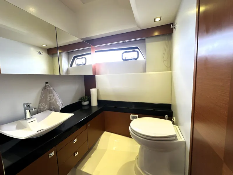 Slide: The Image of Luxurious bathroom in 2013 Prestige 500 yacht with modern fixtures and elegant design. - 49