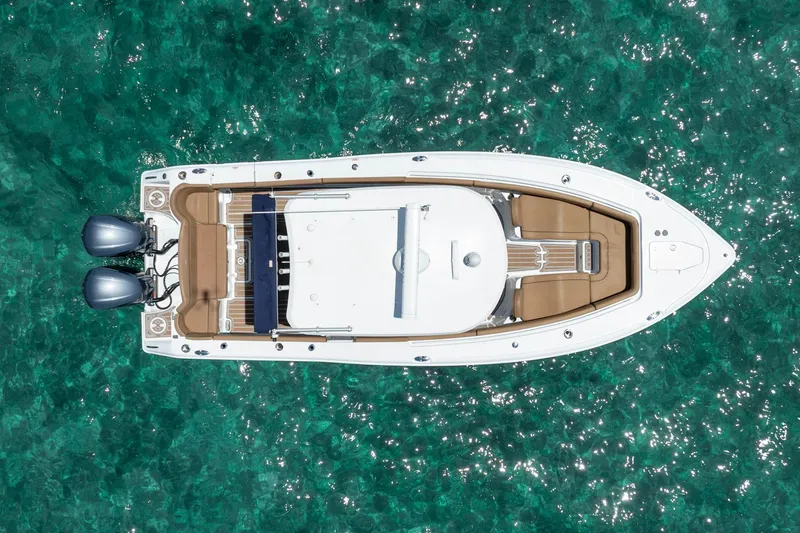 Slide: The Image of Aerial view of 2021 Sea Hunt Ultra 275 SE boat on clear turquoise water. - 17