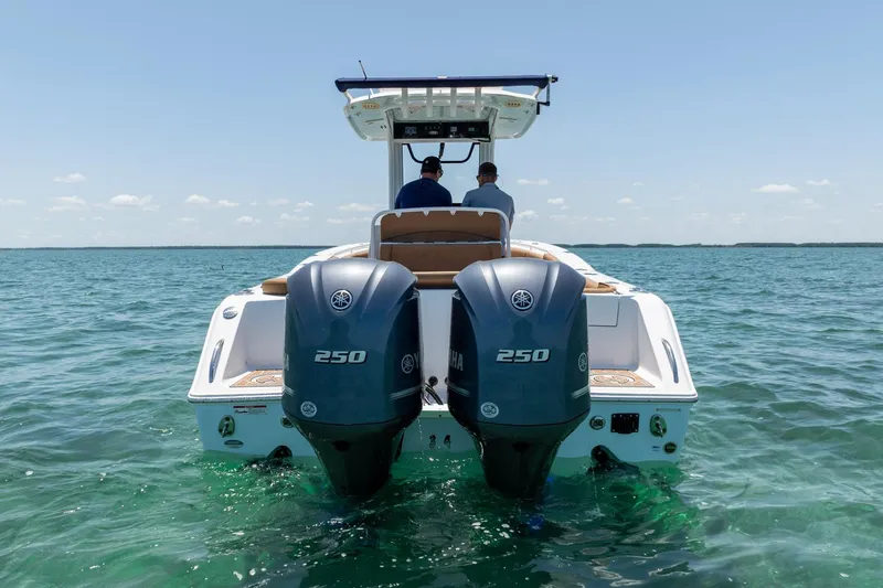 Slide: The Image of 2021 Sea Hunt Ultra 275 SE boat with dual 250 engines on open water. - 8