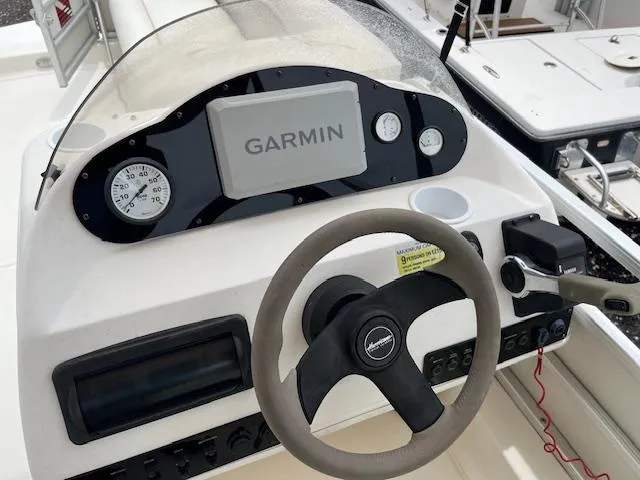 Slide: The Image of Steering console of a 2004 Hurricane FD196RE boat with Garmin navigation system. - 7