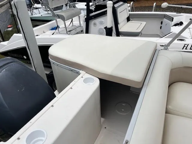 Slide: The Image of 2004 Hurricane FD196RE boat interior with seating and storage compartments. - 8