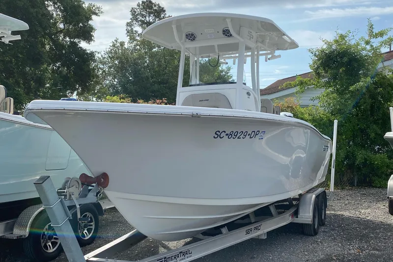 Slide: The Image of 2021 Sea Pro 239 Center Console boat on trailer, parked outdoors. - 0