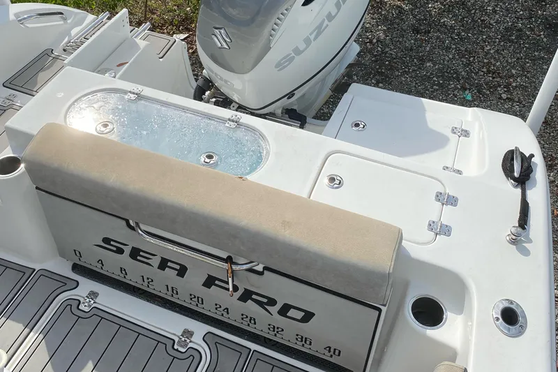 Slide: The Image of 2021 Sea Pro 239 Center Console boat with Suzuki engine and fishing features. - 3