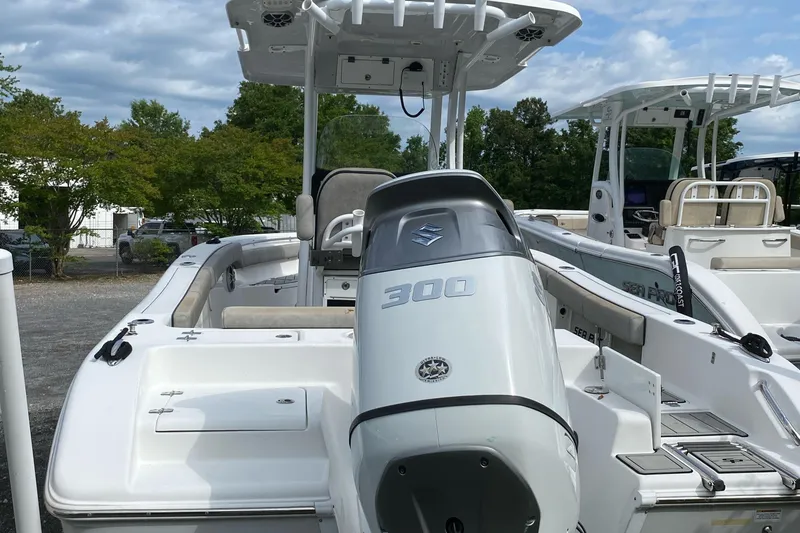 Slide: The Image of 2021 Sea Pro 239 Center Console boat with powerful 300 HP engine, docked outdoors. - 6