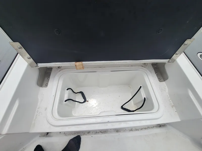 Slide: The Image of Open storage compartment in 2024 Blazer Bay 2440 boat. - 31