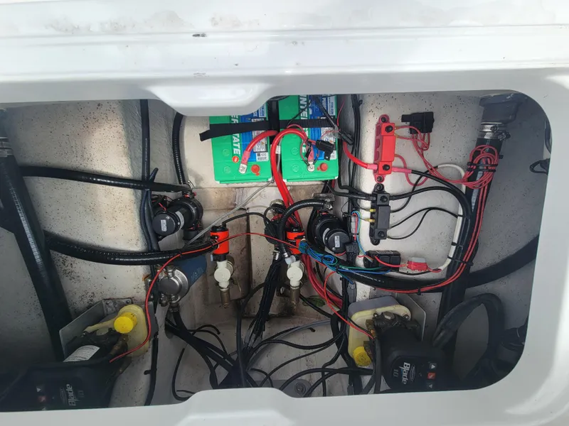 Slide: The Image of 2024 Blazer Bay 2440 boat wiring and battery compartment. - 32