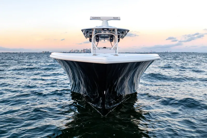 Slide: The Image of 2023 Yellowfin 34 boat on open water at sunset, showcasing sleek design and performance. - 10