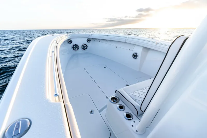 Slide: The Image of 2023 Yellowfin 34 boat interior with ocean view at sunset. - 18