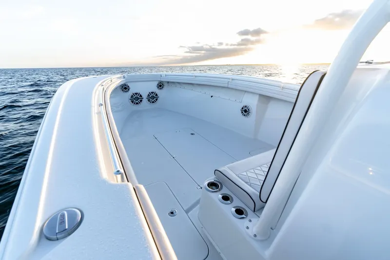 Slide: The Image of 2023 Yellowfin 34 boat on open water at sunset, showcasing spacious deck design. - 20