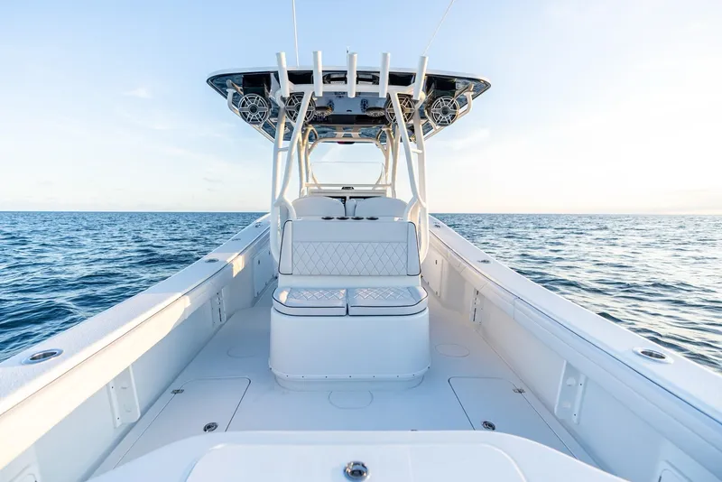 Slide: The Image of 2023 Yellowfin 34 boat on open sea, showcasing sleek design and spacious deck. - 21